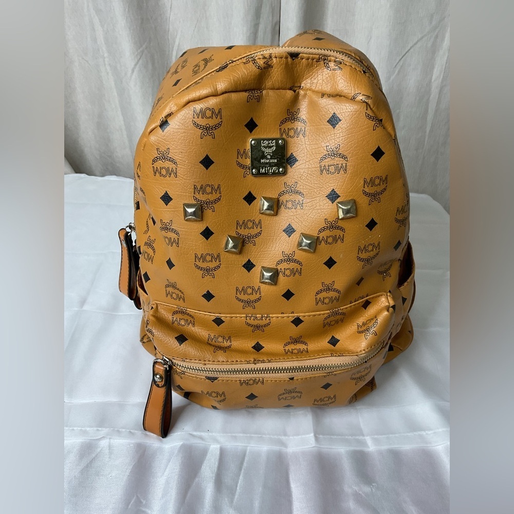 MCM Tan Backpack with Iconic Monogram Design